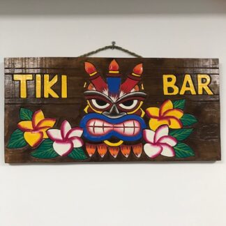 'Tiki bar' sign with candles on head