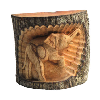 Natural wood elephant in tree trunk