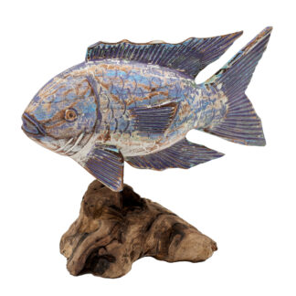 Painted fish on driftwood