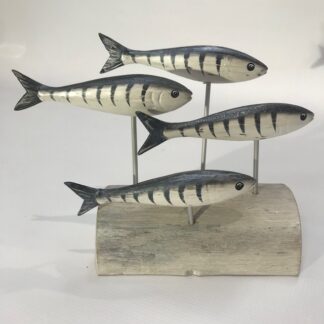 Four mackerels on a stand