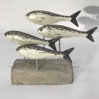 Four sardines on stand