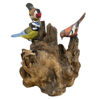 Three painted birds on root