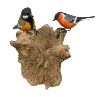 Two painted birds on root