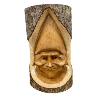 Natural wood goblin in tree trunk