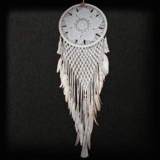 Macrame dreamcatcher with flower motif and feather tassels